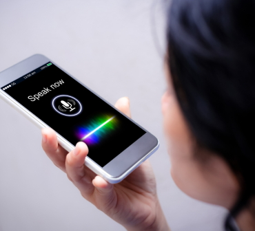 an image of a woman using voice search to highlight Audio Marketing from Chavez Media